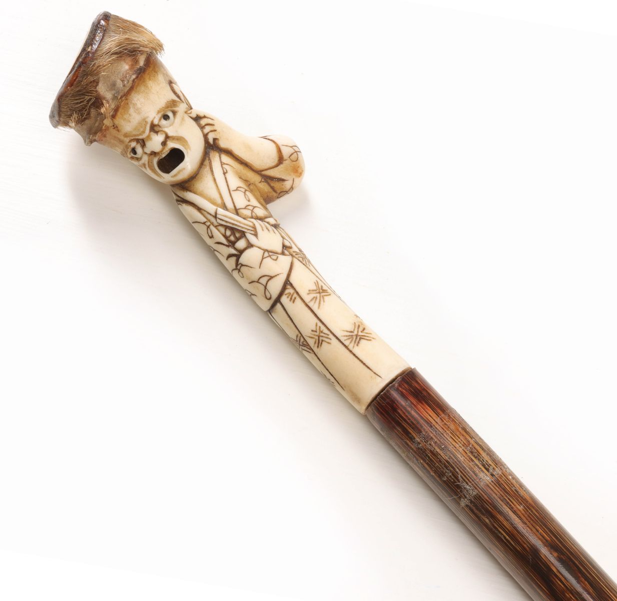 AN UNUSUAL CARVED STAG AND PARTRIDGE WOOD CANE