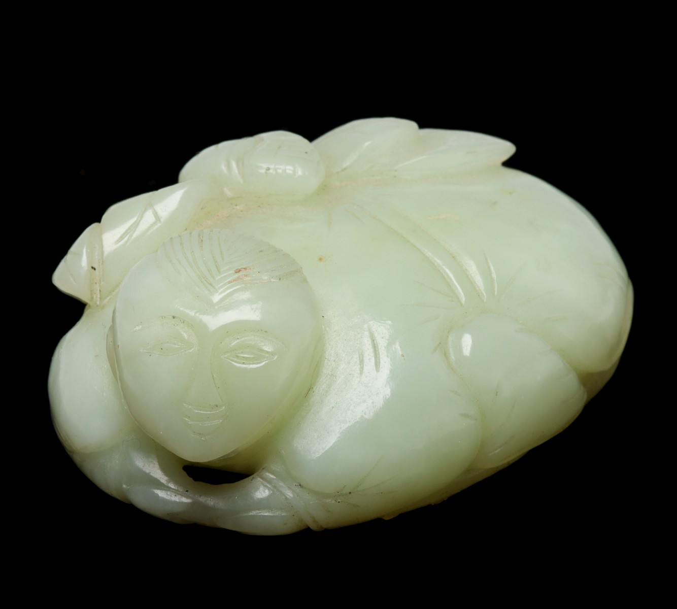 A CARVED HEITIAN JADE ORNAMENT