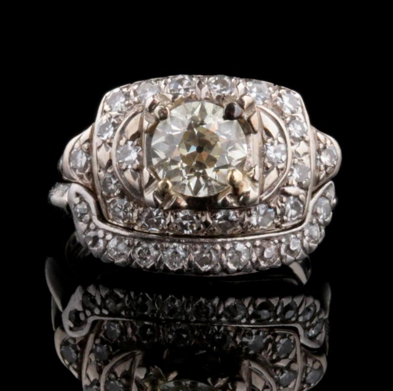 A 14K WEDDING RING WITH ESTIMATED 1 CARAT DIAMOND
